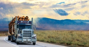 Logging truck on scenic highway