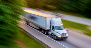 Truck driving on country highway