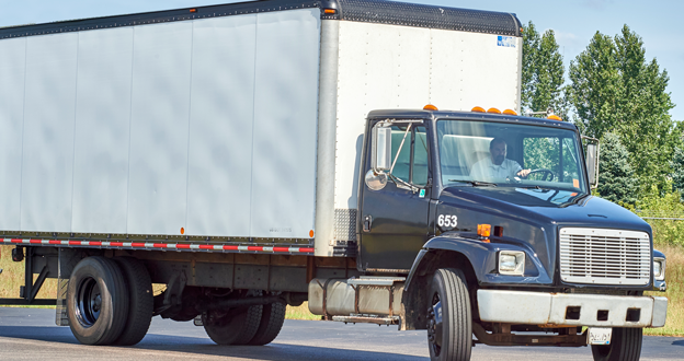 Man driving box truck