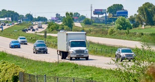 Box truck on divided highway traffic